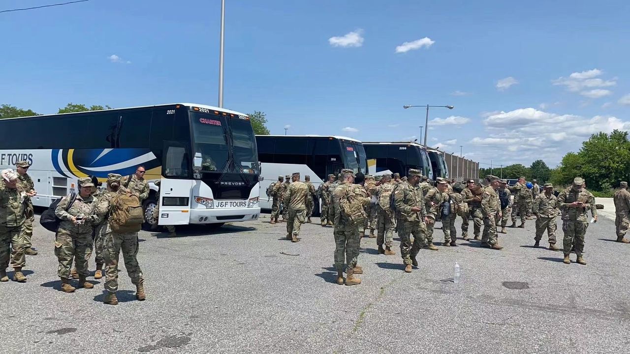 A J&F Tours coach fleet staged for a large group departure