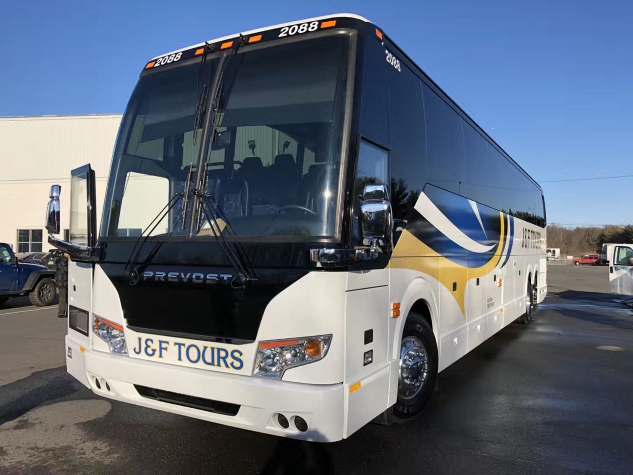 J&F Tours Prevost coach with door open, ready to board